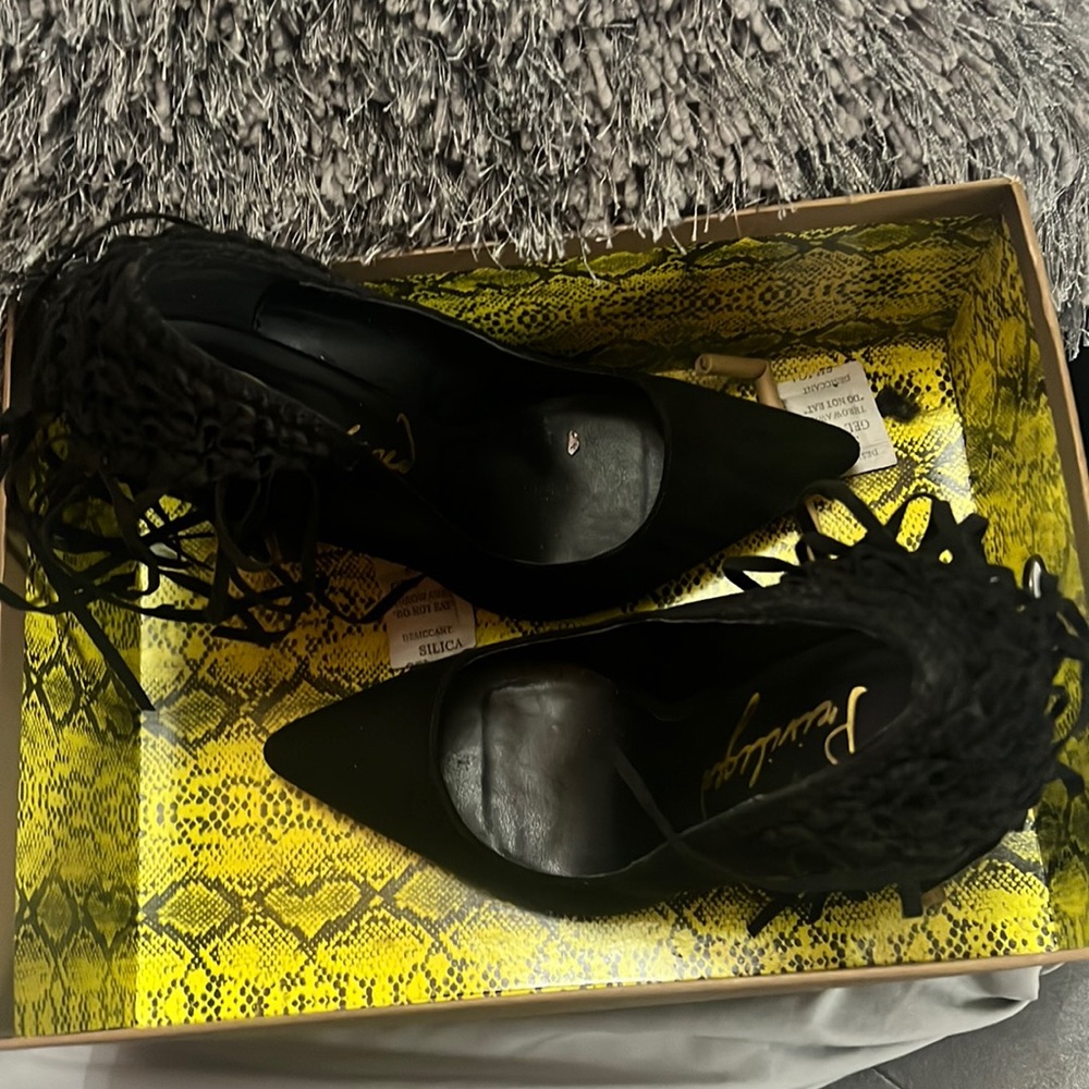 Black suede fringe pumps